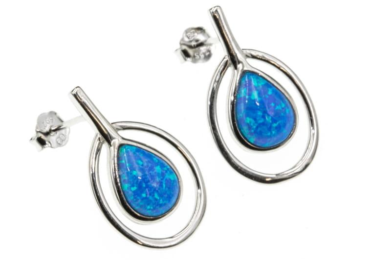 Kolczyki srebrne z opalizującym niebieskim oczkiem na sztyfcie SK9990